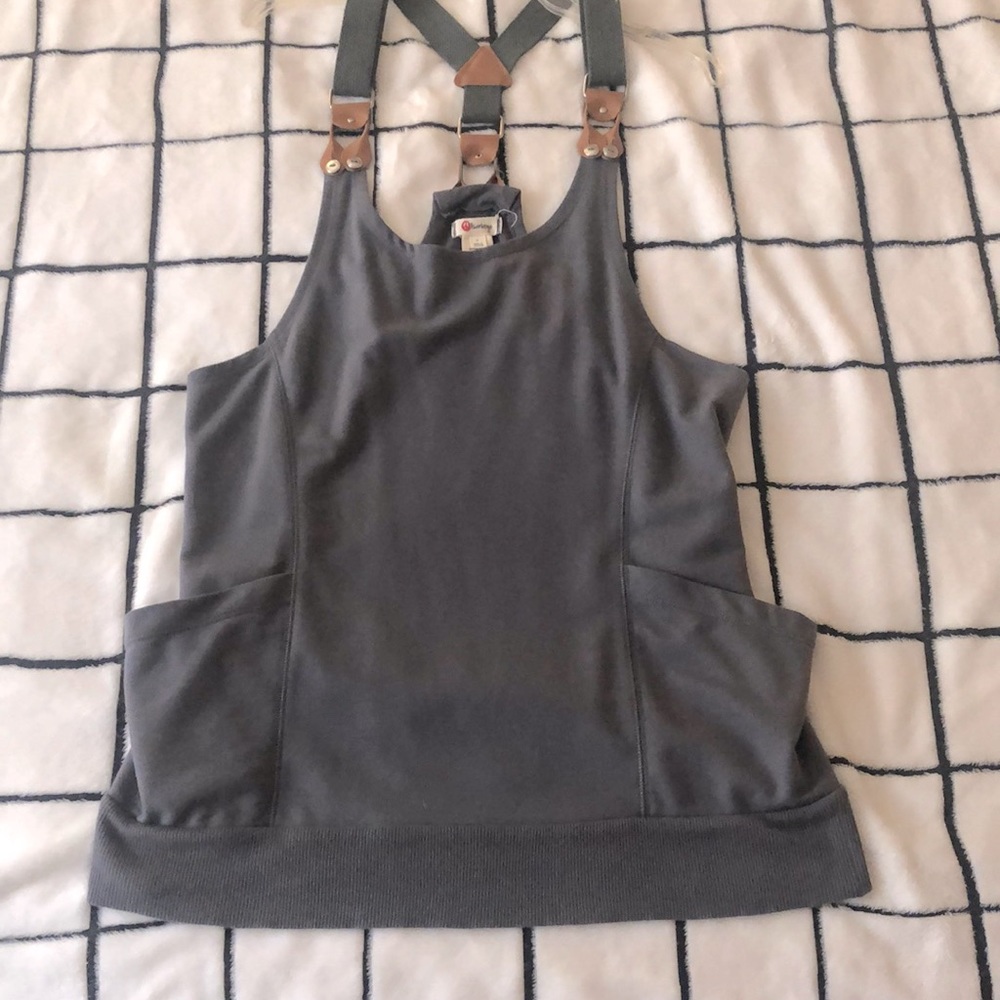 Never worn. Gray Sz. L (runs small. More like a medium) Sweatshirt material.